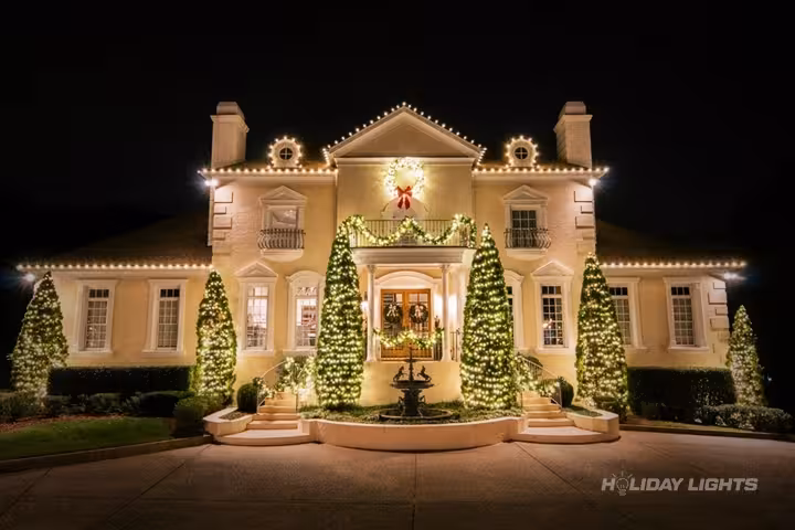 Elegant roofline Christmas lights with decorated evergreen trees for New England homes Elegant roofline Christmas lights with decorated evergreen trees for New England homes