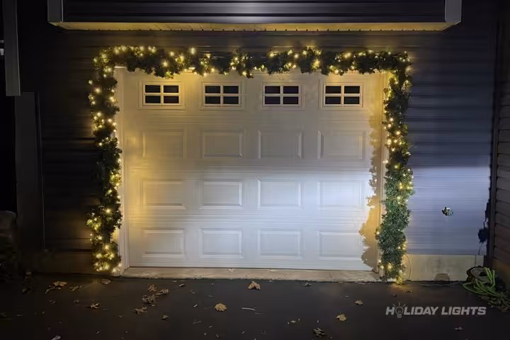 Professional residential Christmas light installation in South Eliot, Maine — Garage Door Garland Display